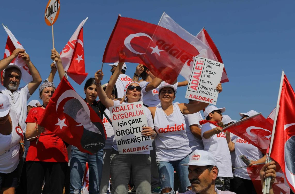 People wave Turkish flags during a rally to mark the end of the main opposition Republican People's Party (CHP) leader Kemal Kilicdaroglu's 25-day long protest, dubbed "Justice March", against the detention of the party's lawmaker Enis Berberoglu, in Istanbul, Turkey, on July 9, 2017. (REUTERS/Huseyin Aldemir)