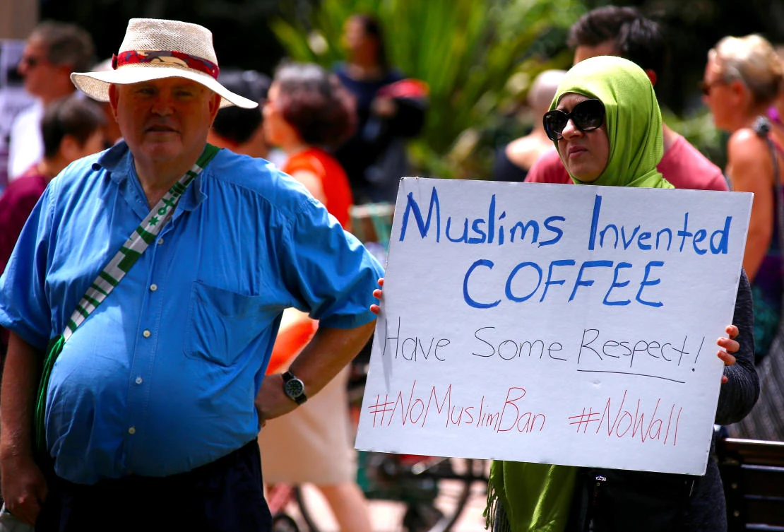 A protester holds a placard in Sydney in one of several rallies across Australia. (Reuters)
