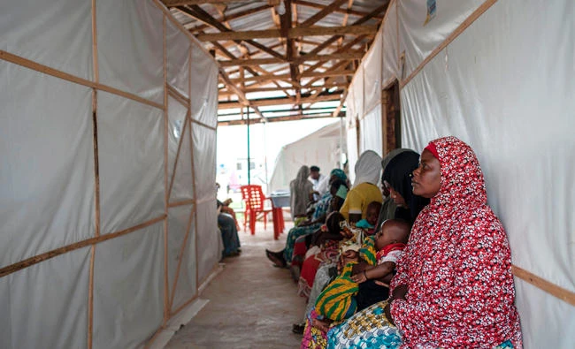 Women sit in the waiting area of the IRC (International Rescue Committee) health clinic in Bakassi IDP (Internally Displaced People) Camp in Maiduguri last week. (AFP)