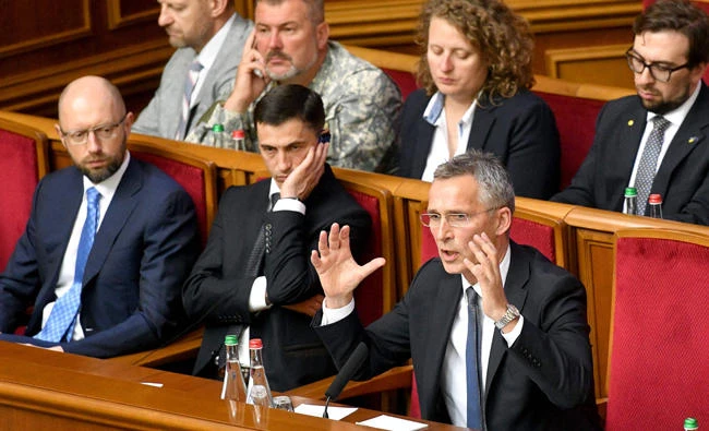NATO Secretary General Jens Stoltenberg, right, answers questions after his speech at the Ukrainian Parliament in Kiev Monday. (AFP)