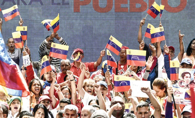 Supporters of Venenzuelan President Nicolas Maduro attend a rally in Caracas Sunday. (AFP)