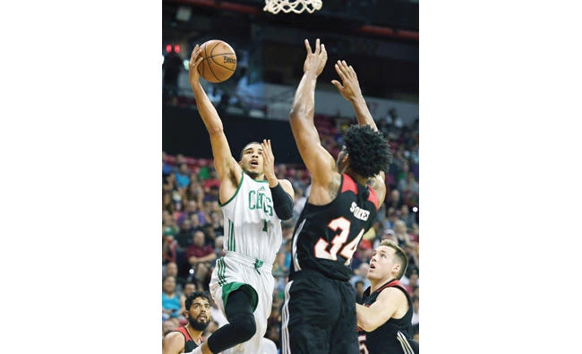 Jayson Tatum (11) of the Boston Celtics shoots against Jarnell Stokes of the Portland Trail Blazers during the 2017 Summer League at the Thomas & Mack Center on Sunday in Las Vegas, Nevada. (AFP)