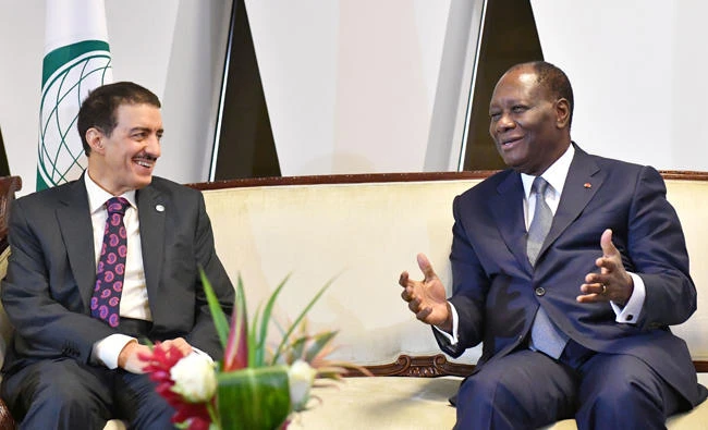 Ivory Coast President Alassane Ouattara (R) and Islamic Development Bank (IsDB) President Bandar Al Hajjar meet after the opening of the 44th meeting of the Ministers of Foreign Affairs of the Organization of Islamic Cooperation on July 10, 2017 in Abidjan. (AFP / ISSOUF SANOGO)