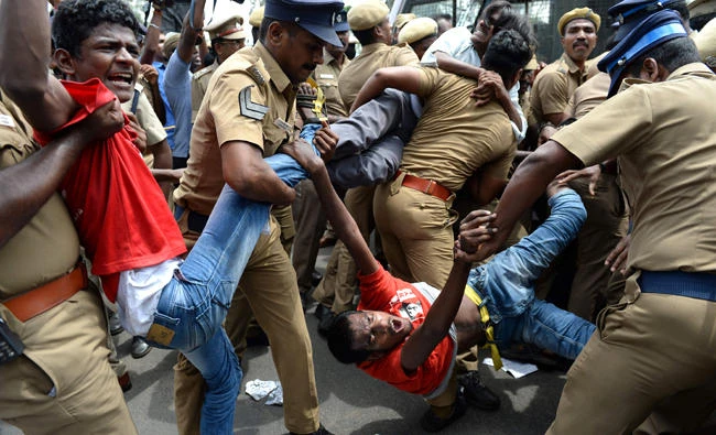 Indian police removing members of the Revolutionary Students and Youth Front during a protest against ban on the sale of cows for slaughter in Chennai in this file photo. (AFP)