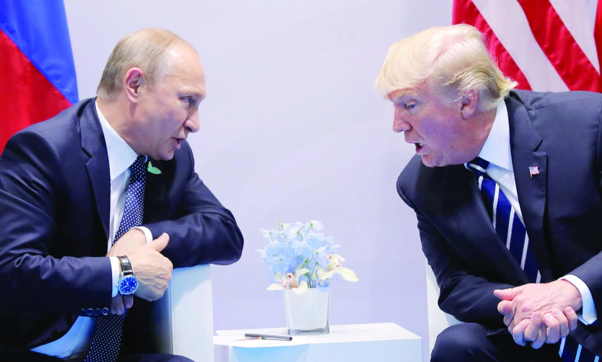 U.S. President Donald Trump speaks with Russian President Vladimir Putin during their meeting in this file photo. (Reuters)