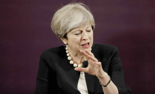 Britain’s Prime Minister Theresa May answers a question during an event in London on Tuesday. (AFP)