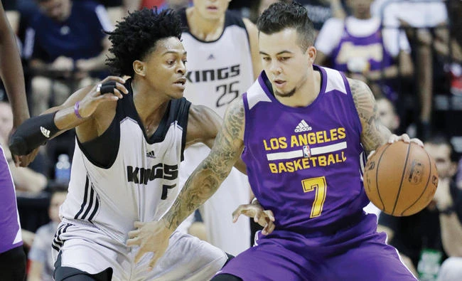 Sacramento Kings' De'Aaron Fox, left, guards Los Angeles Lakers' Gabe York during the first half of an NBA summer league basketball game Monday in Las Vegas. (AP)