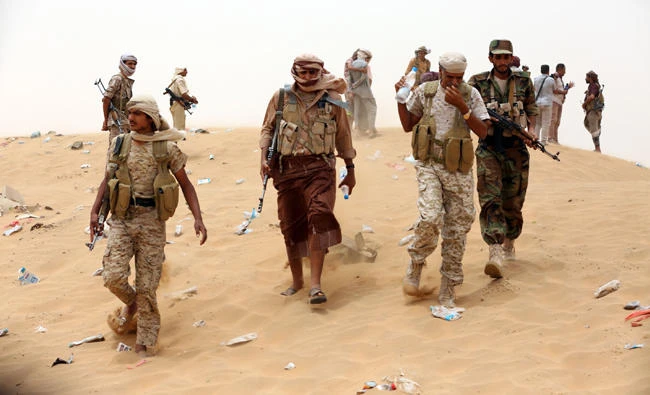 Yemeni soldiers from the Popular Resistance Committees, supporting the UN-recognized government, are seen in Sirwah, west of Marib city, where they are the fighting against Shiite Houthi rebels and their allies on June 30, 2017. Government forces have also made gains in the Haam mountain area in Matoon, north of Jouf governorate, after battles with Houthis and Ali Abdullah Saleh’s militias.(AFP / ABDULLAH AL-QADRY/file photo)
