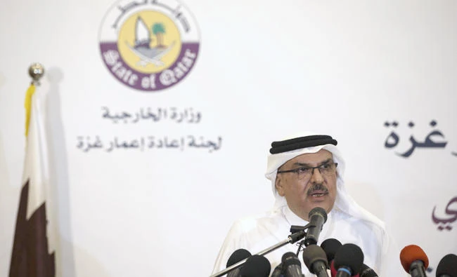 Qatar’s ambassador to Gaza Mohammed al-Emadi speaks during a press conference in Gaza City on Tuesday with UN Special Coordinator for the United Nations for the peace process in the Middle East. (AFP / MAHMUD HAMS)