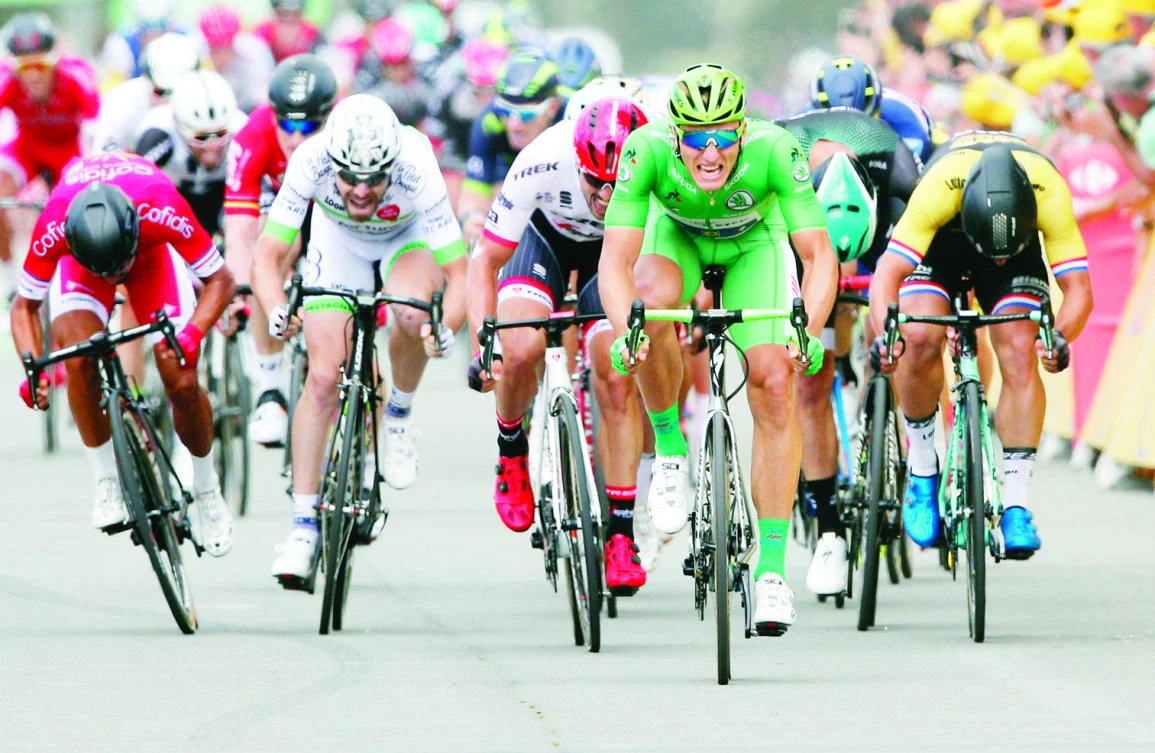 Germany’s Marcel Kittel, wearing the best sprinter’s green jersey, sprints to cross the finish line to win the 10th stage of the Tour de France cycling race over 178 kilometers (110.6 miles) with started in Perigueux and finished in Bergerac, France, Tuesday. (AP)
