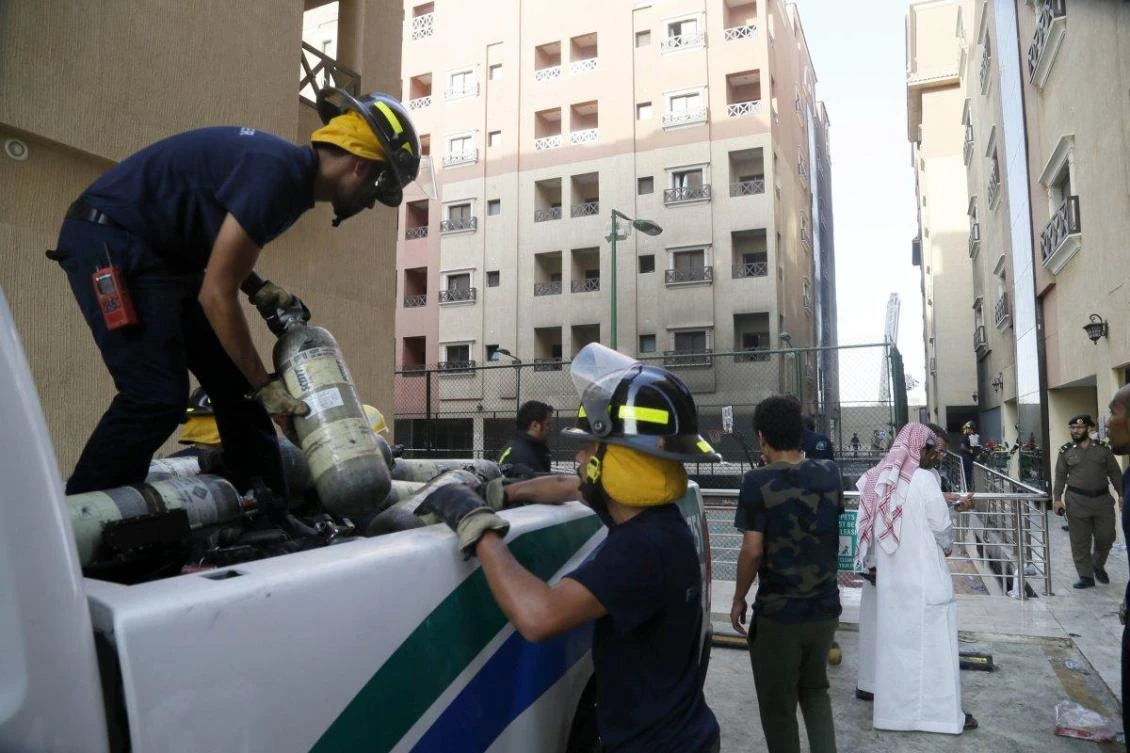 FILE - Firefighters load equipment into a vehicle after putting out the blaze. (AFP)