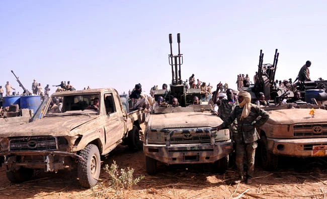In this file photo, Members of the Sudanese Armed Forces and the Rapid Support Forces in rebel vehicles which they captured, after they defeated the Justice and Equality Movement rebels in the Gouz Dango area in South Darfur. (REUTERS/Stringer)