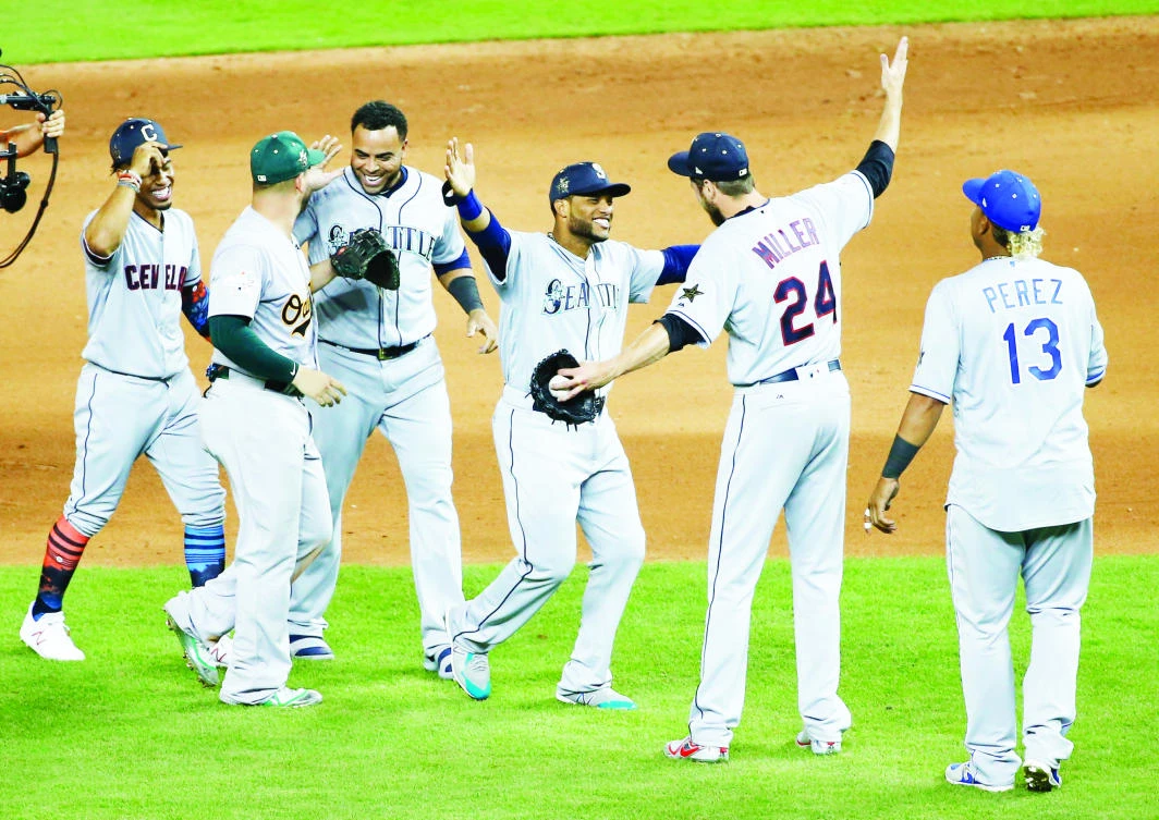 American League teammates celebrate after winning the MLB baseball All-Star Game Tuesday in Miami.
The American League defeated the National League 2-1 in 10 innings. Seattle Mariners' Robinson Cano, third from right,
hit the game winning home run. (AP)
