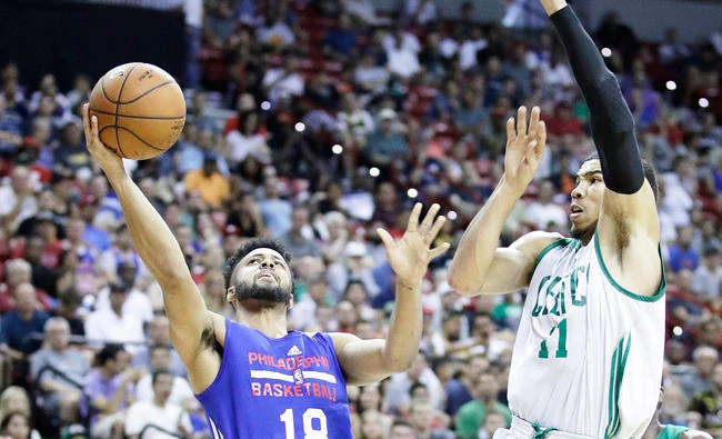 Philadelphia 76ers' Melo Trimble shoots around Boston Celtics' Jayson Tatum during the first half of an NBA summer league basketball game Tuesday in Las Vegas. (AP)