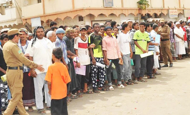 In this file photo, Yemenis displaced by the war in their country apply for visitor IDs at the General Directorate for Passports office in Jazan. (File photo)