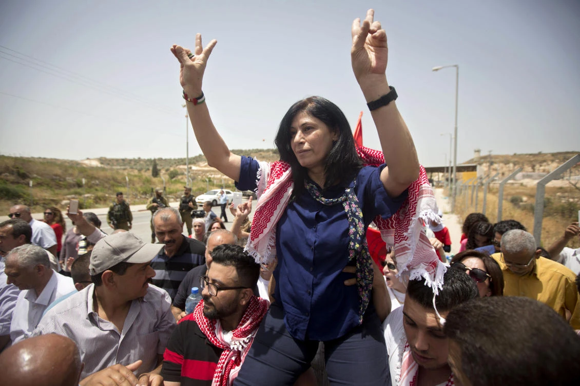 Palestinian lawmaker Khalida Jarrar is greeted by supporters after her release from an Israeli prison at Jabara checkpoint near the West Bank town of Tulkarem in June 3, 2016, file photo. (AP)