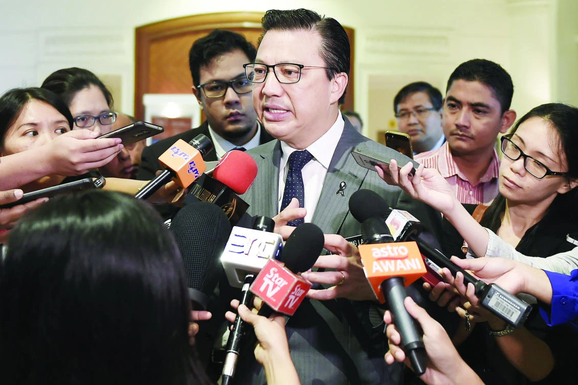 Malaysia’s Transport Minister Liow Tiong Lai talks to journalists following a closed-door gathering to commemorate the third anniversary of the downing of Malaysia Airlines flight MH17, in Putrajaya, outside Kuala Lumpur on Thursday. (AFP)