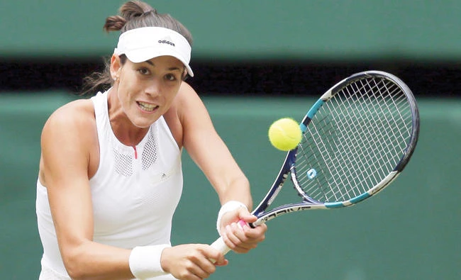 Spain's Garbine Muguruza returns to Slovakia's Magdalena Rybarikova during their women's singles semifinal match on day nine at the Wimbledon Tennis Championships in London Thursday. (AP)