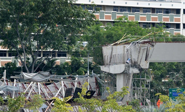 This view shows the collapse of an under-construction elevated highway in Singapore on Friday. (AFP / ROSLAN RAHMAN)