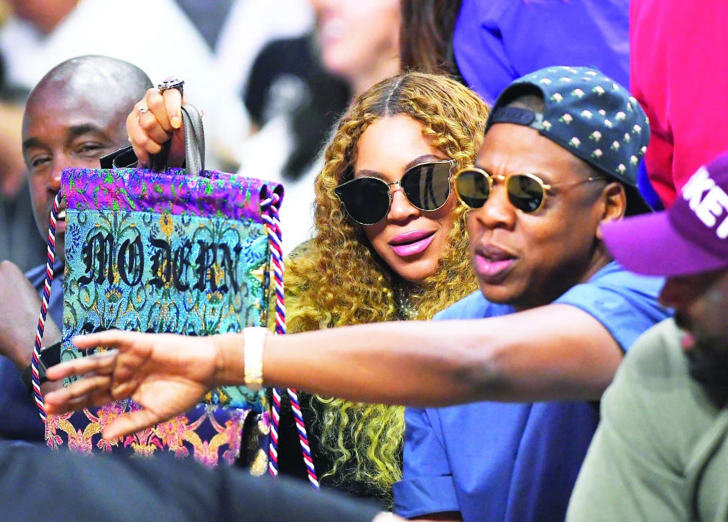 Beyonce and her husband Jay Z watch a basketball game in Los Angeles in this April 30 file photo. (AP)