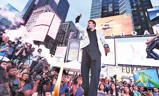 Bollywood actor Siddharth Kannan hosts the IIFA Stomp in Times Square to kick off the 18th International Indian Film Academy (IIFA) Festival in New York, on Thursday. (AFP)