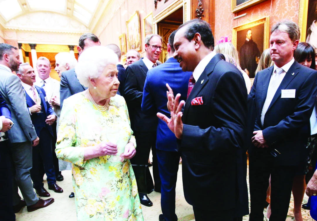 Yusuff Ali MA, chairman of LuLu Group, interacts with Queen Elizabeth during a reception for the Queen’s Awards 2017 winners, at the Buckingham Palace.