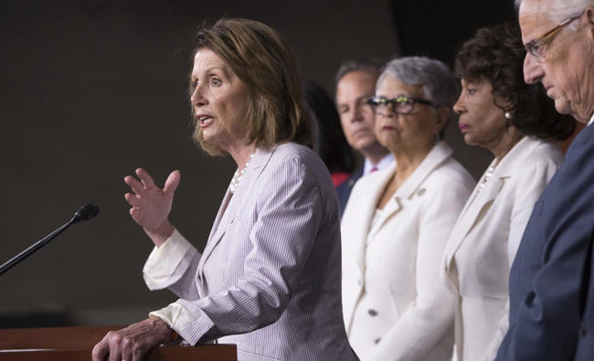 House Minority Leader Nancy Pelosi of California, accompanied by other House Democrats, speaks during a news conference on Capitol Hill in Washington on Friday to renew calls for a vote on an independent commission to investigate Russia's election meddling and ties to the Trump administration and also says that presidential adviser Jared Kushner's security clearance should be revoked. (AP Photo/J. Scott Applewhite)