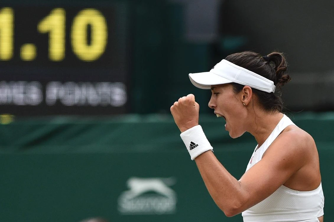 Spain’s Garbine Muguruza celebrates winning a point against US player Venus Williams during their women’s singles final match on the twelfth day of the 2017 Wimbledon Championships at The All England Lawn Tennis Club in Wimbledon, southwest London, on July 15, 2017. (AFP)