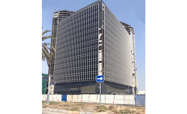 Image Caption :Abu Dhabi Islamic Bank is replacing the recently installed exterior cladding panels on its new headquarters building in Abu Dhabi, UAE. (AN photo)