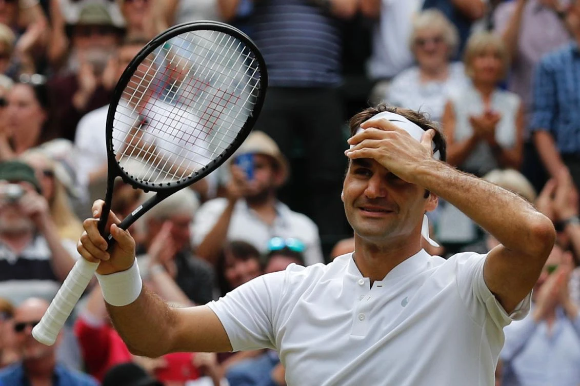 Switzerland’s Roger Federer celebrates after winning against Croatia’s Marin Cilic during their men’s singles final match on the last day of the 2017 Wimbledon Championships at The All England Lawn Tennis Club in Wimbledon, southwest London, on July 16, 2017. Roger Federer won 6-3, 6-1, 6-4. (AFP)