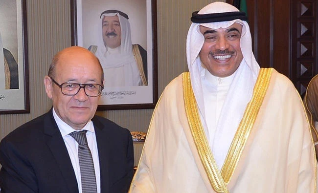 Kuwaiti Foreign Minister, Sheikh Sabah al-Khaled al-Sabah, right, receiving his French counterpart Jean-Yves Le Drian in Kuwait City on Sunday. (AFP)