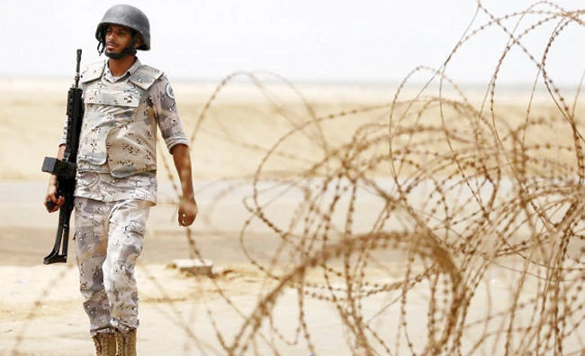 A Saudi soldier walks along the Kingdom’s border with Yemen in this file photo. (Reuters)
