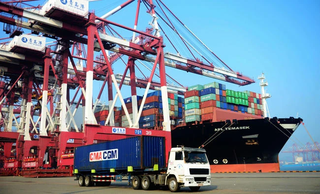A loaded container ship is seen at a port in Qingdao, eastern China's Shandong province on July 13, 2017. Bilateral talks aimed at reducing the US trade deficit with China have yielded some initial deals, but US firms say much more needs to be done as a deadline for a 100-day action plan expired on Sunday. (AFP)