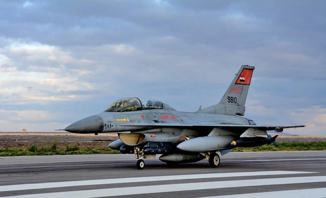 (FILES) --- A file handout picture released by the Egyptian Ministry of Defense on February 16, 2015 shows An Egyptian air force fighter jet landing at an undisclosed location in Egypt following air strikes in Libya. Egypt's military on Sunday said its jet-fighters have destroyed 15 all-terrain vehicles carrying weapons and explosives along with "criminal elements" after they were detected getting ready to cross the Libyan border into Egypt. (AFP file photo)