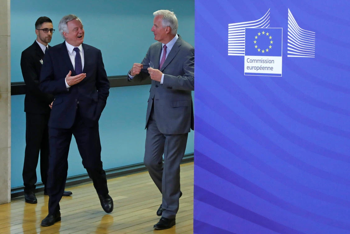 UK Secretary of State for Exiting the European Union David Davis is welcomed by the European Commission's Chief Brexit Negotiator Michel Barnier at the start of a first full round of talks on Britain's divorce terms from the European Union, in Brussels, Belgium July 17, 2017. (REUTERS)