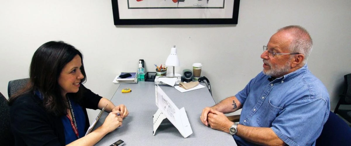 In this July 6, 2017 photo, Kim Mueller, left, administers a test to Alan Sweet, where he describes an illustration, as part of a University of Wisconsin-Madison study on dementia. The study found that for some people subtle changes in everyday speech can be correlated with early mild cognitive impairment, which can be a precursor to Alzheimer's. (AP)