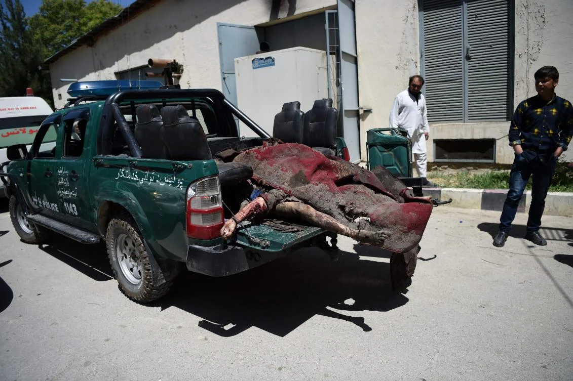EDITORS NOTE: Graphic content / (FILES) This file photo taken on May 31, 2017 shows the bodies of Afghan victims of a car bomb attack loaded in the back of a police vehicle at a hospital in Kabul. Civilian deaths in Afghanistan hit a record high in the first half of 2017, with 1,663 killed and more than 3,500 injured, the United Nations said July 17. (AFP)