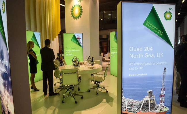 A woman wears visual reality glasses at the British Petroleum (BP) stand on July 11, 2017 during 22nd World Petroleum Congress in Istanbul. Oil major bosses and energy ministers are meeting at the World Petroleum Congress in Istanbul, with the outlook clouded by the low price of crude oil, currently trading at around 45 dollars a barrel compared with a peak of over 145 dollars in 2008. (AFP / OZAN KOSE)