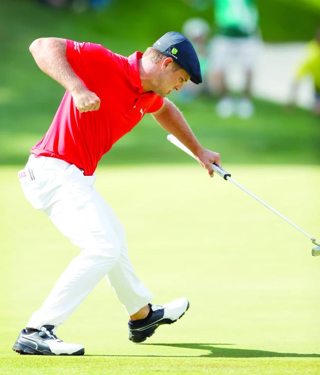 Bryson DeChambeau reacts after making a birdie putt on the 18th green during the final round of the John Deere Classic golf tournament Sunday. (AP)