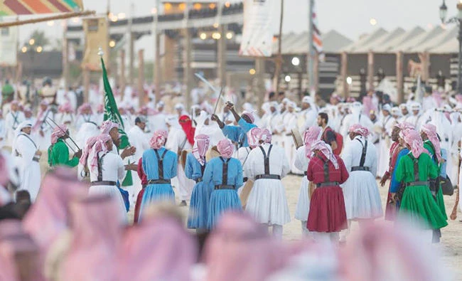 Performers display a traditional dance at Souq Okaz festival.