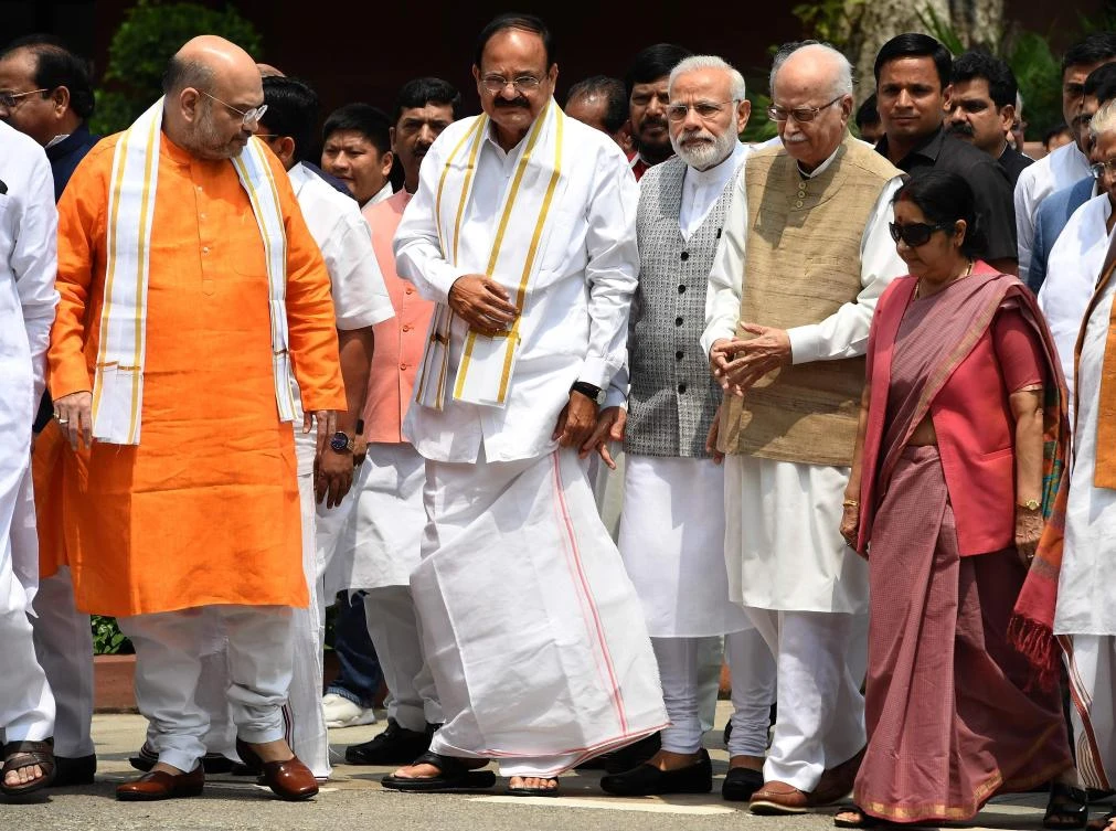 Bhartiya Janata Party (BJP) Leader Venkaiah Naidu (2L) arrives alongside BJP President Amit Shah (L), Indian Prime Minister Narendra Modi (C) and senior leaders L. K. Advani (2R) and Sushma Swaraj (R) to file his nomination papers for the forthcoming vice-presidential election at Parliament in New Delhi on July 18, 2017. Naidu has been chosen as National Democratic Alliance (NDA) candidate for the forthcoming vice-presidential election. (AFP)