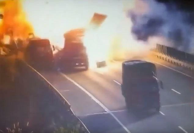 A lorry explodes in a ball of flames after clipping the back of a stationary vehicle (YouTube)
