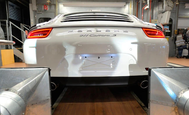 In this file photo, a Porsche 911 sportcar during tests at the German luxury car maker's factory site in Stuttgart, southwestern Germany. Investigators in Germany said Monday July 10, 2017, they are probing employees of luxury sports car maker and Volkswagen subsidiary Porsche over emissions cheating. (AFP)