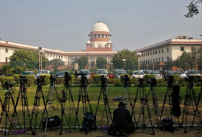 FILE PHOTO: A television journalist sets his camera inside the premises of the Supreme Court in New Delhi, India, February 18, 2014. (REUTERS)