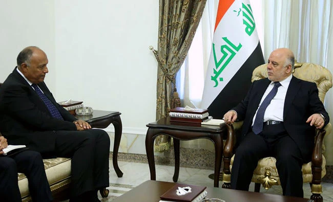 Prime Minister Haider Al-Abadi, right, meeting with Egyptian Foreign Minister Sameh Shoukry in Baghdad on Wednesday. (AFP)