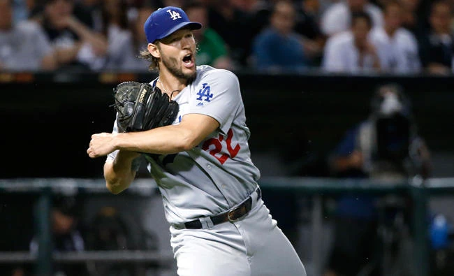 Los Angeles Dodgers starting pitcher Clayton Kershaw spins and throws out Chicago White Sox's Adam Engel at first during the seventh inning of a baseball game Tuesday in Chicago. (AP)