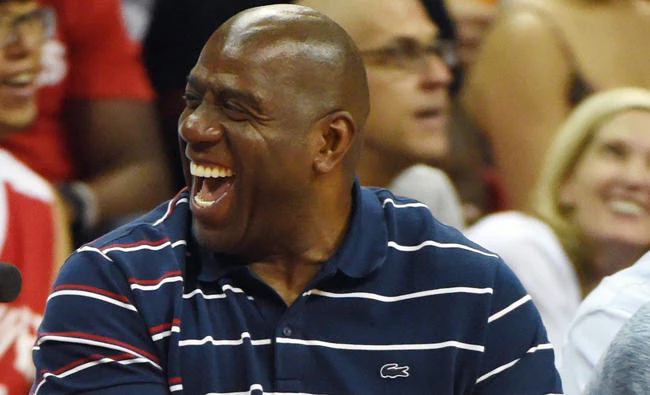 Los Angeles Lakers president of basketball operations, Earvin "Magic" Johnson, smiles during the team's championship game of the 2017 Summer League against the Portland Trail Blazers at the Thomas & Mack Center on Monday in Las Vegas, Nevada. (AFP)