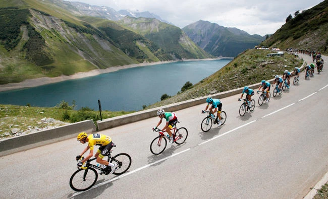 Britain’s Chris Froome, wearing the overall leader’s yellow jersey, is followed by Italy’s Fabio Aru as they climb Croix de Fer pass during the 17th stage of the Tour de France cycling race Wednesday. (AP)