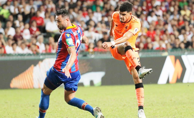 Dominic Solanke of Liverpool FC, right, scores a goal during a day one match against Crystal Palace FC at the Premier League Asia Trophy soccer tournament in Hong Kong. (AP)