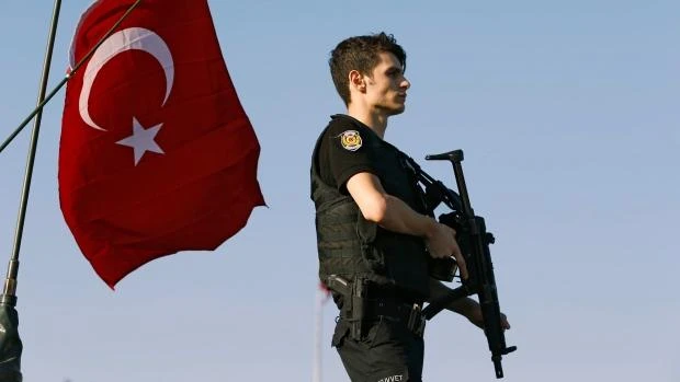 A policeman stands atop of an armoured vehicle in Istanbul, Turkey, in July 2016. Authorities on Tuesday arrested 10 human rights activists after they were reportedly linked to last year's failed coup. (Reuters)